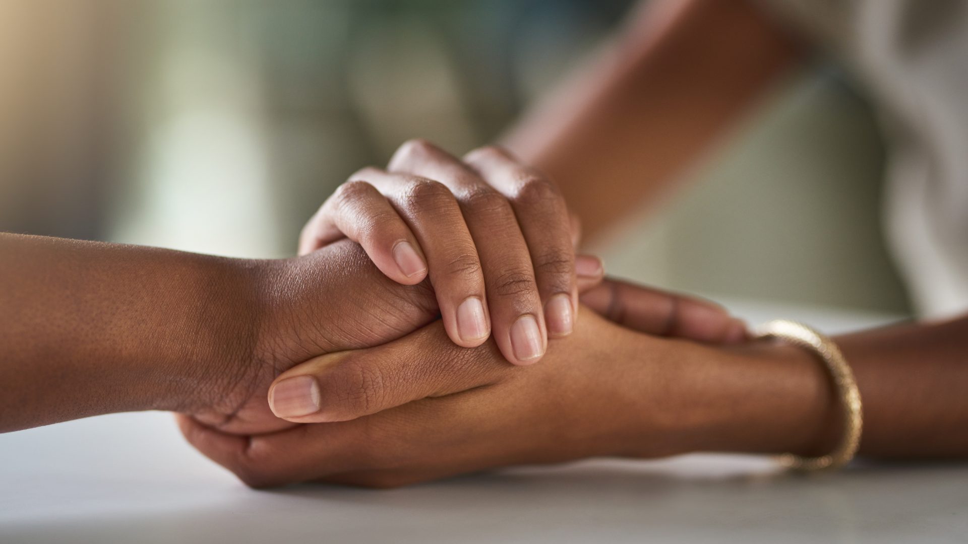 Hands held in support of a family member during benzodiazepine recovery